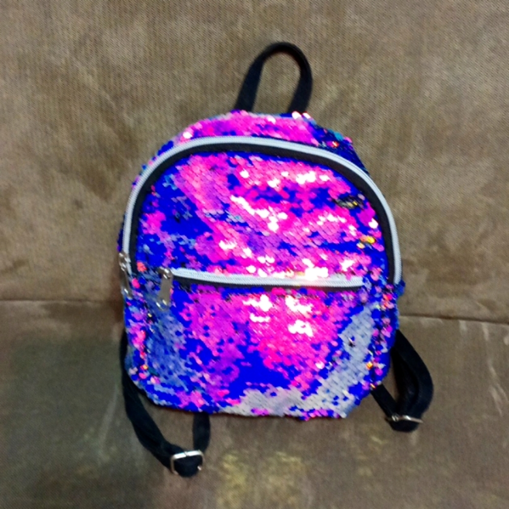 Place sequined front and top zipper top and front back pack bag